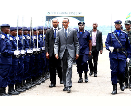 President Kagame inspects a guard of honour mounted by Rwanda National Police at the passing out of cadet-officers at Police Training Academy in Gishari, Rwamagana District, yester....