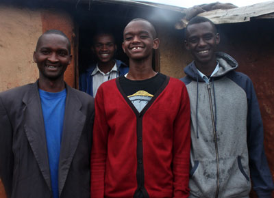 Jean Paul Mugisha with some of his family members. Luck and exceptional performance has seen the Congolese refugee win bursaries throughout his education journey. Collins Mwai.