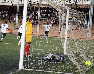 Jean Baptiste Mugiraneza, #7, lead APR celebrations after heading home the winner, which left Etincelles  keeper with face down. Samuel Ngendahimana