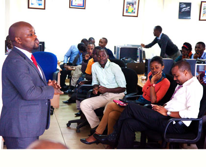Youth and ICT minister Jean P. Nsengimana in Theu00a0New Times newsroom during a Ndi Umunyarwanda discussion. T. Kisambira.u00a0