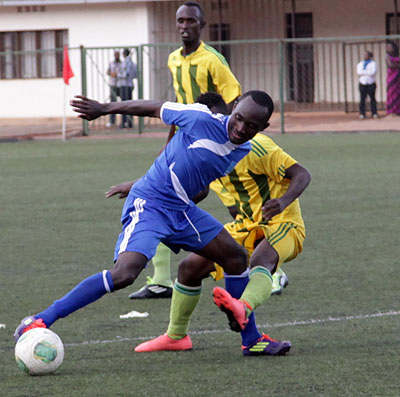 Cedric Amissi with the ball scored a hat-trick to help Rayon Sport advance to the next round of 2014 Peace Cup. John Mbanda.