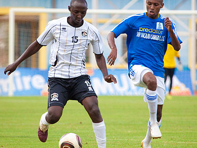 APRu2019s Andrew Buteera takes on Jamal Mwiseneza of Rayon Sports during last yearu2019s encounter at Amahoro Stadium. (Internet photo)