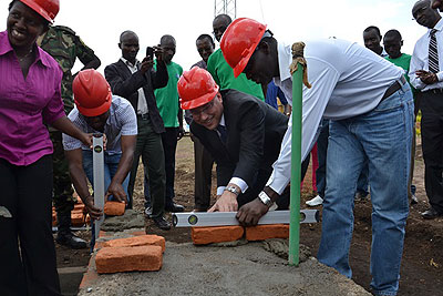 Usaid Rwanda Mission Director Peter Malnak (2nd right), and the Minister for Natural Resources, Stanislas Kamanzi (right) at the ground-breaking ceremony for the construction of th....