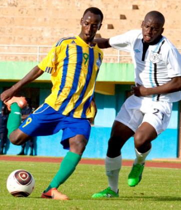 Spain-based Fiston Nkinzingabo takes on a Botswana player in a previous U-17 qualifying match. He will  lead Rwanda's search for goals against South Sudan. T. Kisambira. 