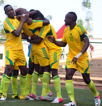 AS Kigali players celebrate Rodrigue Murengeziu2019s goal against Al  Ahly Shendi at Stade de Kigali in the last round. File.