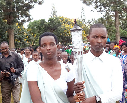 The Kwibuka Flame is carried to Rukumbeli Sector in Ngoma District yesterday. (Jean-Pierre Bucyensenge)