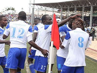 Djamal Mwiseneza (#8), celebrates with teammates after giving Rayon Sports the lead against APR on Sunday. (John Mbanda)