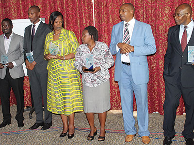 The winners pose for a photo after the awards ceremony on Friday. (Solomon Asaba)