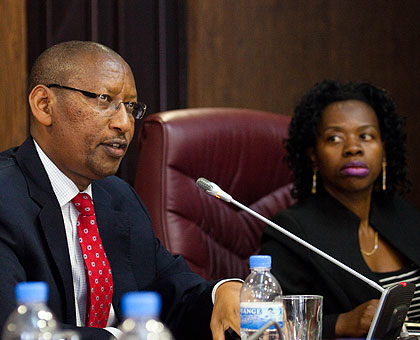 Central bank governor John Rwangombwa (L) and his deputy, Monique Nsanzabaganwa, address the media in Kigali yesterday. (Timothy Kisambira)