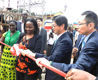 Isumbingabo (2nd L) and Ogawa (C) inaugurate a substation in Musha. (Stephen Rwembeho)