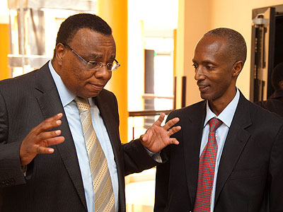 Kenyan High Commissioner to Rwanda John Mwangem (L), chats with the Director General of Immigration and Emigration, Anaclet Kalibata, at the meeting at Lemigo Hotel yesterday. (Tim....