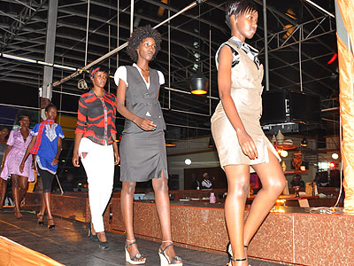Models display designs on the runway during the Kigali Fashion Week 2012. (File)