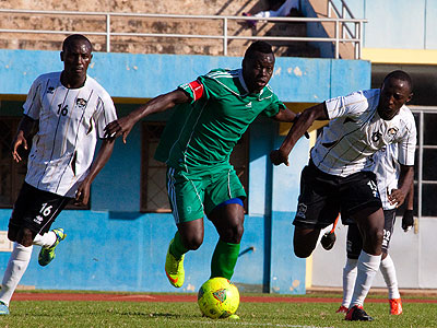 Kiyovu striker and captain Julius Bakabulindi, center, seen here playing against APR in a previous league match, will be biggest threat for Police defenders this afternoon. (Timoth....