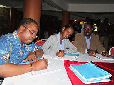 Dr Cosma Wilungula (DRC), Rica Rwigamba (Rwanda) and Dr Andrew Seguya (Uganda) sign the strategic plan. (Courtesy)