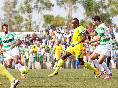 AS Kigali striker Jimmy Mbaraga controls the ball past Jadida defender Ahmed Chagou during the first leg. Chagou converted a spot kick to score the third goal for the Moroccans yes....