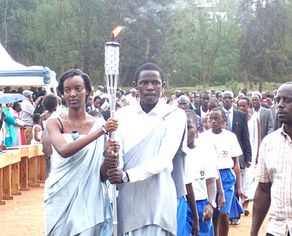 The Flame arrives at Camp Kigali in Nyarugenge from Kirehe District yesterday. (Jean-Pierre Bucyensenge)