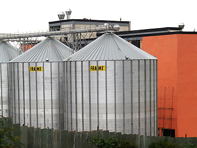 Bakharesa milling factory in Kigali. Experts have urged government to keep the cost of doing business down so as to attract investors. (Timothy Kisambira)