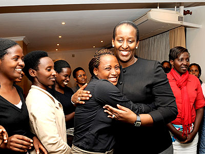 First Lady Jeannette Kagame with young Genocide survivors. (Courtesy)