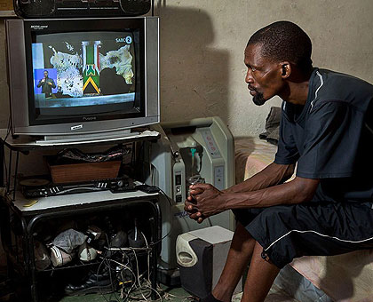 A man watches TV. Analysts say the increase in internet and cell phone penetration will affect TV viewership in the future. (Internet photo)