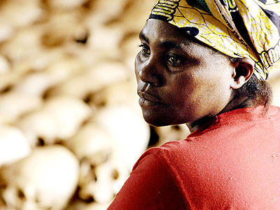 A survivor in a sad mood in this an undated picture taken at a Genocide memorial site. (Internet photo)