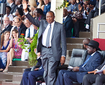 Kenyatta acknowledges his introduction to the crowd on Monday. (Timothy Kisambira)