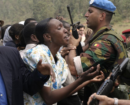 Film actors reconstruct a scene in which victims were pleading with departing Unamir forces to rescue them at ETO Kicukiro. File.