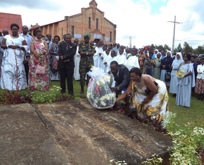 Residents of Kibeho pay their respects to Genocide victims killed at the church last weekend. Jean Pierre Bucyensenge.