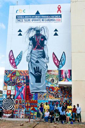 A tall mural on a wall of the Rwanda Biomedical Center (RBC) building features artworks against HIV stigma and promotes u201cpositive livingu201d within the community.