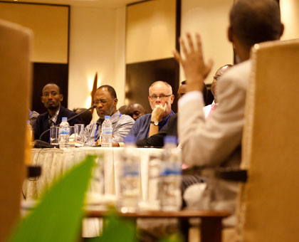 Delegates at the summit listen to The New Timesu2019 Kennedy Ndahiro, a panelist at the forum, make a point. T. Kisambira.