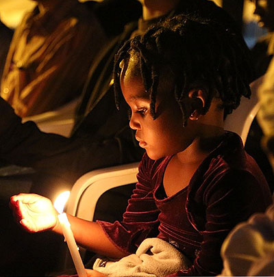 A young girl keeps vigil for the victims of the 1994 Genocide against the Tutsi. Both the people of Rwanda and the Jews have suffered some of the worst atrocities the world has eve....