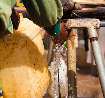 A kid drawing water in Karongi District.Timothy Kisambira. 