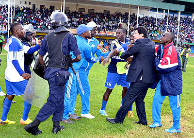 AT THE FORE; Rayon Sports head coach Luc Eymael, and striker Cedric Amissi, 3rd from right, have been banned for setting off the violence last week. File