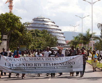 Members of the Pentecostal Church walk for hope and peace in Kigali yesterday. Timothy Kisambira.