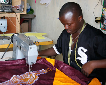 A tailor at work. The meeting, ahead of Labour Day, will address challenges in the labour market. Timothy Kisambira.