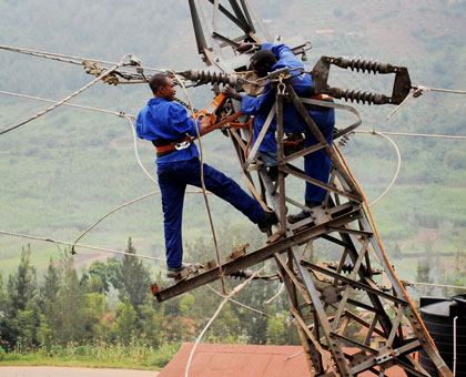 EWSA workers fix electric cables. File.