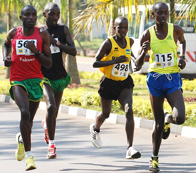 Alex Nizeyimana, 2nd from left, and Godfrey Rutayisire, right, will be among the home favourites in the half and full marathons respectively. File.