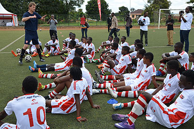 Arsenal Legend Tony Adams tips African youngsters who have been attending the Airtel-Arsenal soccer clinic in Rwanda. He is launching Coach the Coaches course today. S. Ngendahimana.