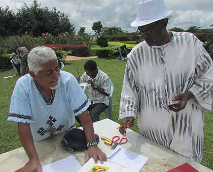 Binamungu (R) working with artists on his farm. (Joseph Oindo)