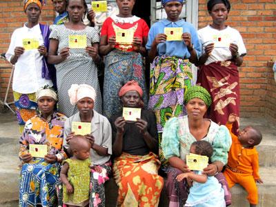 Women display their health insurance cards. (File)