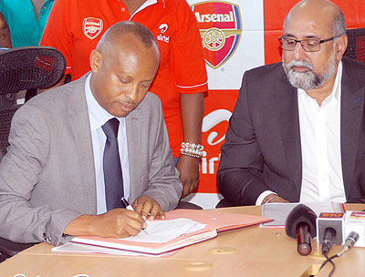 Ferwafa Vice president Vedaste Kayiranga and Airtel Rwanda Managing Director Teddy Bhullar sign the agreement.