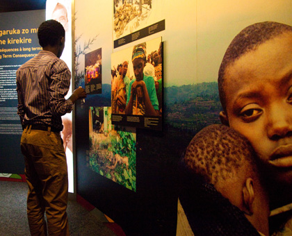 Visitors look at pictures in Kigali Genocide Memorial Centre. Munyaneza (bottom) lost his conviction appeal in Canada. (File)