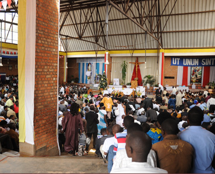 The faithful attend a service at St. Michel church. The Church is accused of not doing enough in reconciliation efforts. File.