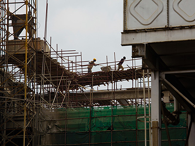 Workers at a construction site in Kigali. Obtaining permits will be flexible. T. Kisambira. 
