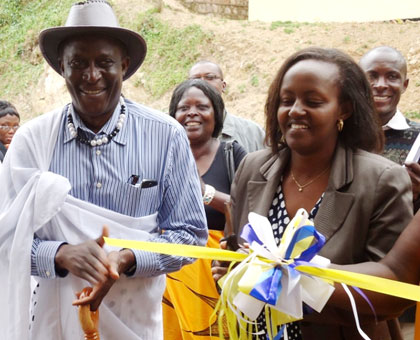 Dr Kanyandekwe (R) and Mau00efga launch the Milk Bar on Friday.  Hyppolite Ntigurirwa.