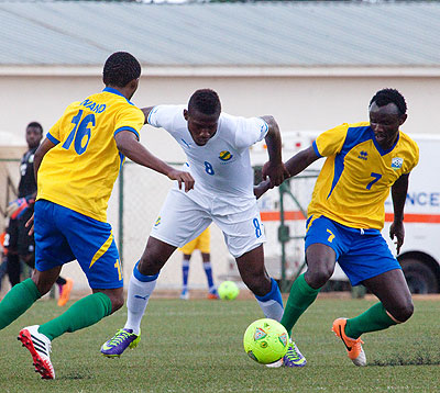 Midfielder Muhamed Mushimiyimana shields the ball from Gabonu2019s striker Ibrahim Mba in the first leg of second round of the AYC qualifiers played yesterday at Kigali Regional stadium. Timothy Kisambira.