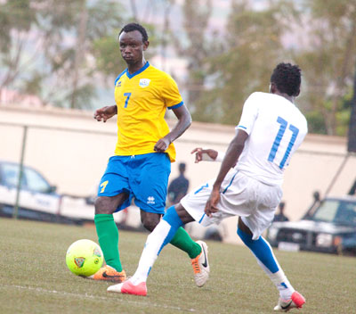 Midfielder Muhamed Mushimiyimana dribbles past Gabonese striker Aubyang Junior Bayanho in Sundayu2019s first leg match of the Africa Youth Championship qualifier played at Kigali Regional Stadium. T. Kisambira