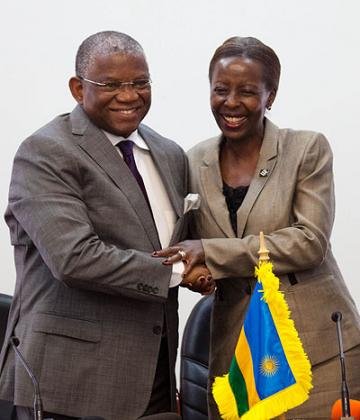 Minister for Foreign Affairs, Louise Mushikiwabo (R), and her Angolan counterpart, Georges Rebelo Chikoti, share a light moment after the signing.Timothy Kisambira. 