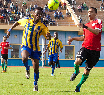 Striker Dady Birori seen against Libyan defender last year, will be key for Amavubi as they seek an away win on Sunday. T. Kisambira