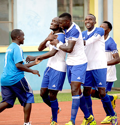 Rayon players join striker Cedric Amissi to celebrate a goal during their Africa Champions league return leg tie against Congou2019s Leopards early this year at Amahoro stadium. T. Kisambira