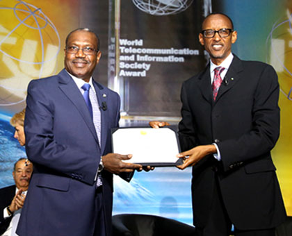 President Kagame is presented with the 2014 World Telecommunication Information Society award by ITU Secretary-General Hamadoun  Toure in Geneva, Switzerland, yesterday. Village Urugwiro.